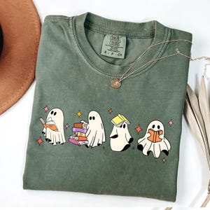 Comfort Colors® Ghost Reading Books Shirt, Bookish Halloween Shirt, Teacher Librarian Halloween Gift, Halloween Book Lover, Halloween School Cute Ghost Reading Book Halloween Tshirt, Ghost Reading Book Girly Shirt, Ghost Girly Halloween Gift, Trendy Halloween Gift