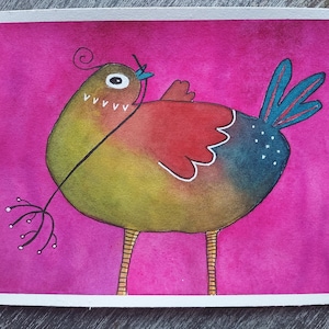 May include: A watercolor painting of a colorful bird with a long, thin beak and a small, round eye. The bird is holding a branch in its beak and has a blue tail feather. The background is a bright pink.