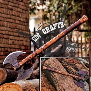 May include: A double-headed axe with a wooden handle wrapped in brown leather. The axe head is black and has a sharp edge. The handle is decorated with a brown and black pattern. The axe is resting on a piece of wood. The text "SM CRAFTS" is visible in the background.