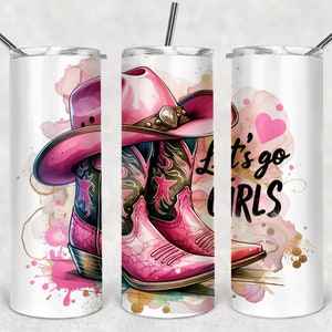 May include: A white stainless steel tumbler featuring a pink cowboy hat and boots design. The tumbler has the text "Let's go girls" with a pink heart.