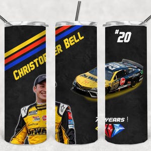 May include: Three black and yellow stainless steel tumblers with a racing theme. The tumblers feature a driver's name, a race car, and a race car number. The tumblers are decorated with yellow, red, and blue stripes.
