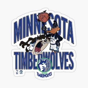 May include: A sticker featuring the Minnesota Timberwolves logo with the words "MINNESOTA TIMBERWOLVES" in blue. The sticker includes cartoon characters Taz and Daffy Duck, with Daffy Duck holding a basketball.