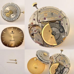 May include: A collection of watch components, including a gold-toned watch face with the text "UNIVERSAL GENEVE GOLDEN SHADOW AUTOMATIC", a silver-colored movement with gears, and a date wheel. Also included are two gold-toned watch hands.