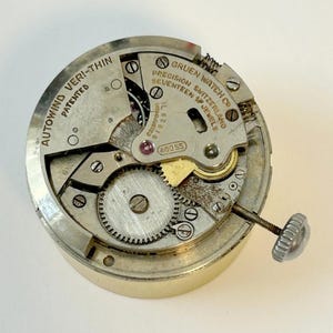 Części zegarka Gruen Cal 460SS Mechanizm Balans Widelec Sprężyna Mostek