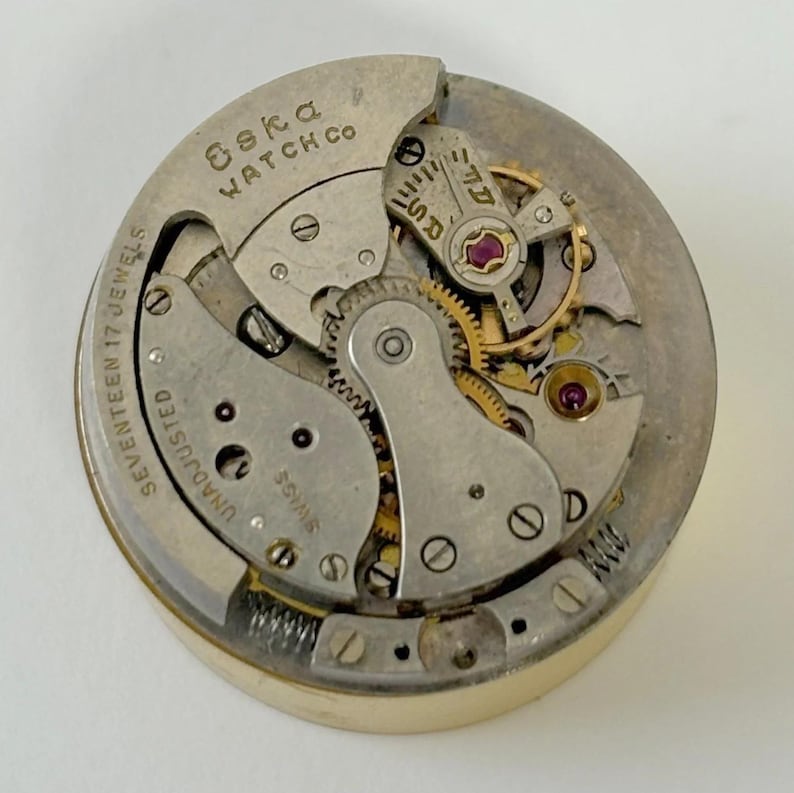 Eska Brevet AS Bumper 24.8 mm Uhrenteile Uhrwerk Unruh Gabel Federbrücke Bild 1