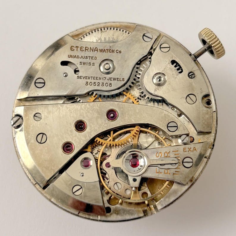 Reloj de bolsillo Eterna Calibre 957, pieza del movimiento, horquilla del volante, muelle, puente, esfera imagen 1