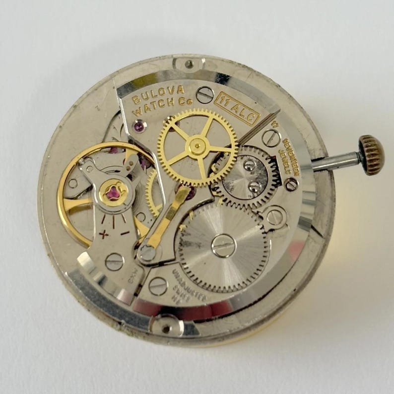 Bulova Cal 11 ALC Uhrenteile Uhrwerk Balance Gabel Räder Federbrücke 11ALC Bild 1