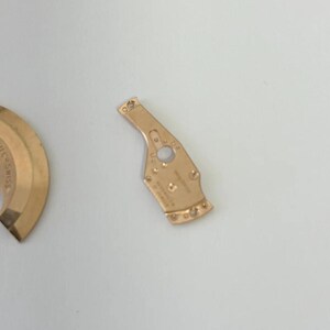 Omega Cal 550 Uhrwerk-Teile Zifferblatt Unruh Federplatte Gabelrad Rotor 6 Bild 11