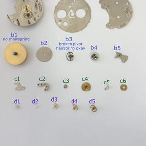 Jaeger LeCoultre Cal 229 Uhrwerkteil Unruhgabel Tonnenrad Platten Bild 1