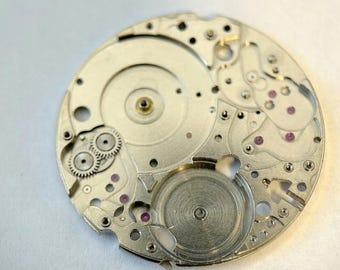Pièce D'horlogerie - Axe De Balancier Pour Montre UNIVERSAL 262 - Neuf Sans Boîte