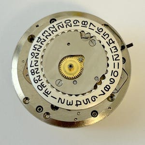 Universal Geneve Polerouter Cal 218-2 Watch Parts Movement Balance Fork Spring image 2