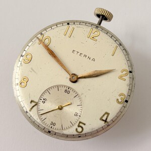 Reloj de bolsillo Eterna Calibre 957, pieza del movimiento, horquilla del volante, muelle, puente, esfera imagen 2