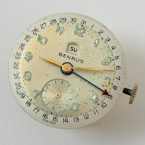 Piezas del reloj Benrus Cal 13 Day Date ETA 900 Movimiento Horquilla Puente de resorte imagen 1