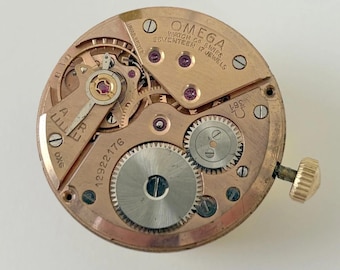 Parti del movimento dell'orologio Omega Cal 361: bilanciere, forcella, molla, ponte, bariletto, ruote