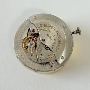 Movimento automatico Longines Calibro 19 AS, parti dell'orologio, bilanciere, molla 19AS immagine 1