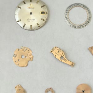 Omega Cal 563 Watch Parts Movement Calendar Disk Fork Wheels Springs Bridge 2 image 2