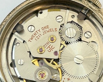 Piezas de reloj Waltham Cal UTC 2291 Movimiento Resorte de volante Esfera Manecilla Fondo de caja