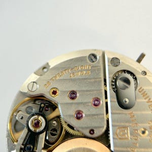 Universal Geneve Polerouter Cal 218-2 Watch Parts Movement Balance Fork Spring image 4