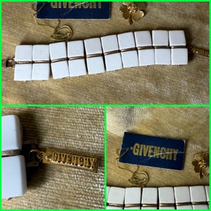 May include: A white ceramic mug with a black handle and the text "But First, Coffee" in a bold, black font. The mug is set against a blurred background, suggesting a cozy setting.