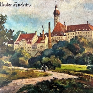 May include: An antique postcard featuring a detailed painting of Kloster Andechs, a historic monastery. The artwork depicts the monastery with red-tiled roofs, a tall steeple, and surrounding trees. A path leads towards the building, with figures walking along it.
