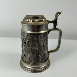 Vintage beer mug made of tin retro beer mug old