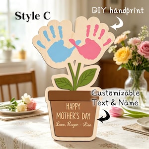 May include: Wooden Mother's Day flower-shaped decoration with blue and pink handprints. The flower pot reads "HAPPY MOTHER'S DAY" and includes the names "Love, Roger - Lisa". The text "Style C" and "DIY handprint" are also visible.