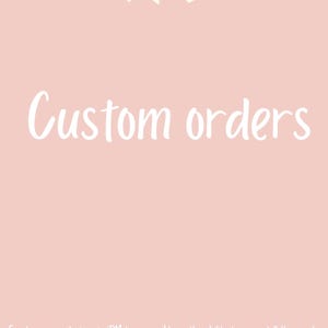 May include: A light pink informational graphic featuring the black text NAILED IT BY A at the top, followed by the white text Custom orders in the centre. The bottom includes white text instructions regarding design submission and tier confirmation.