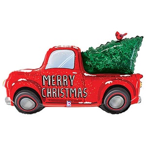 May include: Red toy truck with a Christmas tree and a cardinal on top. The truck has the words "Merry Christmas" written on the side.