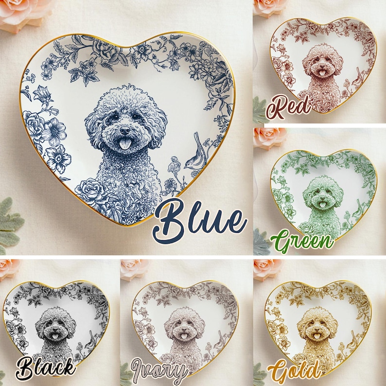 May include: Heart-shaped decorative plates featuring a poodle illustration. The plates come in various colors: blue, red, green, black, ivory, and gold. Each plate has a floral border and a gold rim. The word "Blue" is written on the blue plate.