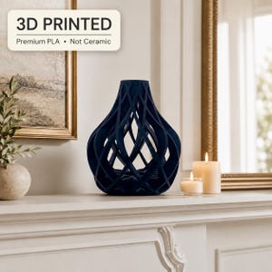 May include: A dark blue 3D printed vase with a hollow, lattice-like geometric structure. The vase is made of premium PLA and is not ceramic. It features a wide base that tapers toward a narrow opening, creating a complex, open-work design.