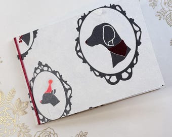 Imperfection:  4x6 mini photo album, dog silhouettes with red foil, made from chipboard/cereal box, holds 12 photos, pet memorial book