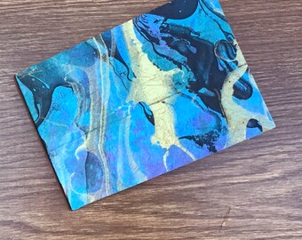 fehlerhaft - hergestellt aus dünner Spanplatte - 4 x 6 Mini-Fotoalbum - marmor-blau-schwarz-gold-lila - horizontaler Fehler