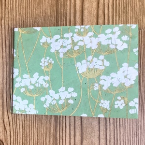 flat- thin chipboard/cereal box - 4 x 6 mini photo album - white flowers gold stem over mint paper