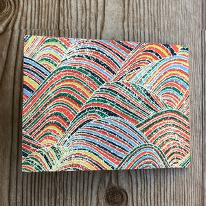 May include: A colorful abstract pattern of overlapping, curved lines in shades of red, green, blue, yellow, and white. The pattern resembles a series of hills or mountains.