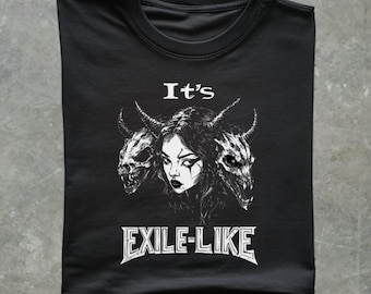 May include: Black t-shirt with a white graphic design of a woman with three demon heads. The text "It's Exile-Like" is printed below the image.