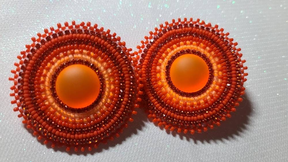 Orange Native American beaded circular earrings on fingernail posts