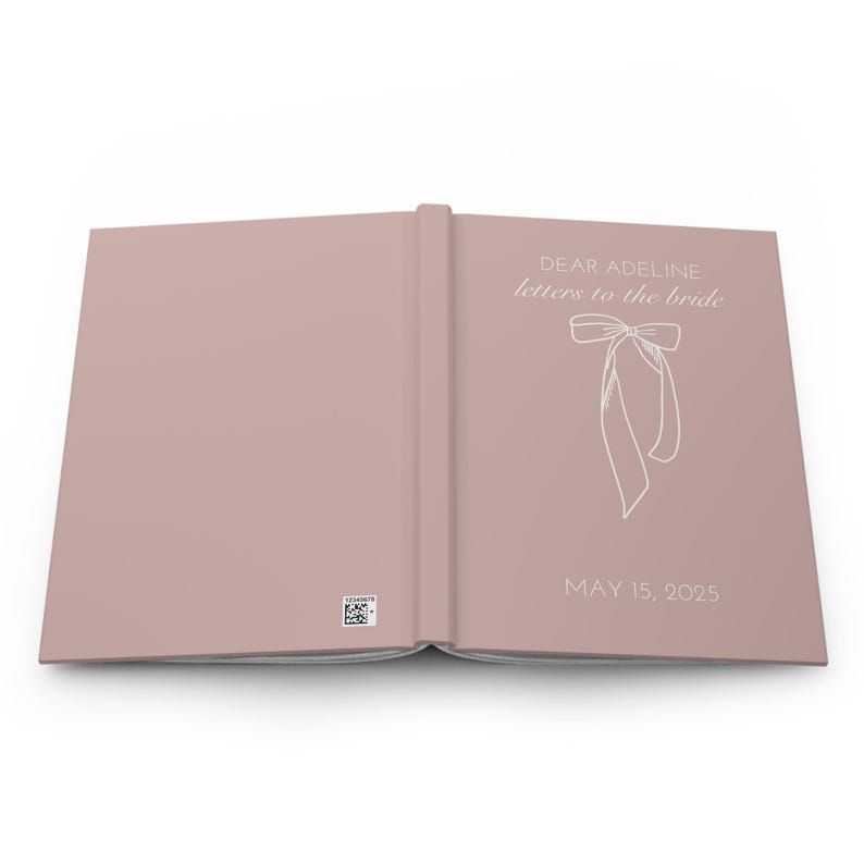 May include: A blush pink hardcover book with the title "Dear Adeline, letters to the bride" and a white bow illustration. The date "May 15, 2025" is printed below the illustration.
