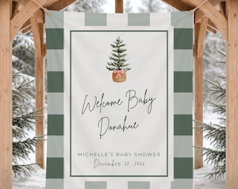 Puede incluir: Un cartel rectangular con un borde de cuadros en verde salvia y blanco. El centro muestra un árbol de Navidad en acuarela con un lazo a rayas rojas y blancas, el texto Welcome Baby Donahue, MICHELLE'S BABY SHOWER y December 20, 2026.