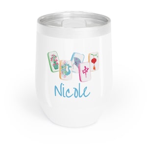 May include: White insulated tumbler with a silver rim, featuring a watercolor design of Mahjong tiles and the name "Nicole" in blue script. The tiles depict flowers, a fan, a lantern, and a peacock.