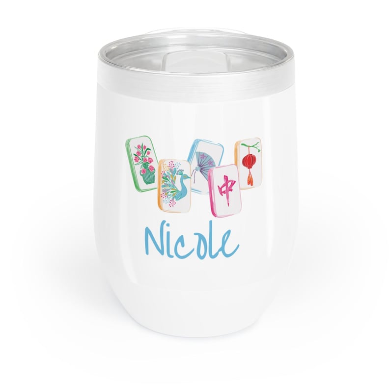 May include: White insulated tumbler with a silver rim, featuring a watercolor design of Mahjong tiles and the name "Nicole" in blue script. The tiles depict flowers, a fan, a lantern, and a peacock.