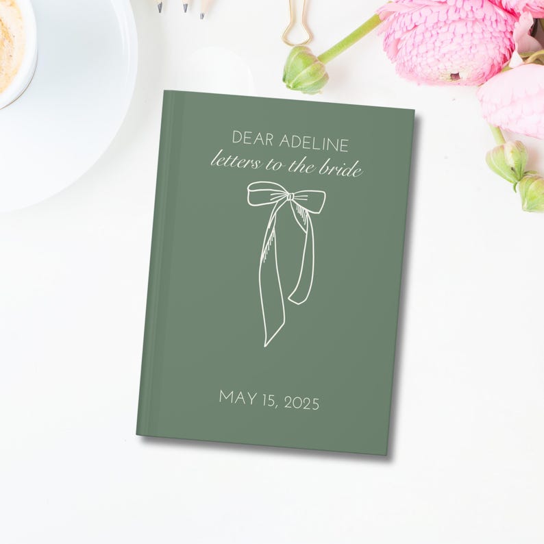 May include: A green journal with the text "Dear Adeline letters to the bride" and a white bow illustration. The date "May 15, 2025" is printed below the bow.