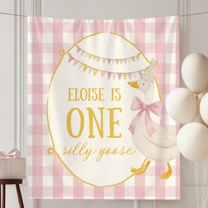 May include: A pink and white gingham backdrop with a large egg-shaped design featuring a goose illustration and the text "Eloise is One silly goose." A bundle of white balloons and a gift box are also present.