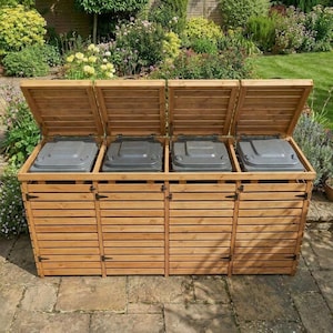 May include: A four-section wooden bin storage unit featuring horizontal slats and four hinged lids that are currently open. Each section contains a dark grey plastic waste bin. The structure is built from light brown wood with black metal hinges.