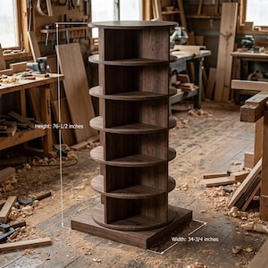 May include: A dark brown wooden corner shelf unit with six circular shelves. The unit is 76.5 inches tall and 34.75 inches wide. The shelves are supported by vertical wooden supports. The unit is in a wood workshop.