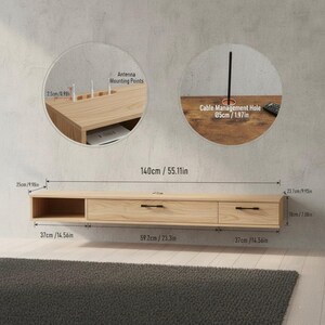 May include: A light-colored, floating TV console with two drawers and an open shelf. The console is 55.11 inches long and 7.08 inches high. It features black handles and a cable management hole. The image also shows antenna mounting points.