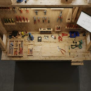 May include: A well-lit workbench with a variety of tools, including screwdrivers, pliers, and saws. The tools are organized on a pegboard and in wooden trays. A blueprint is visible on the right side. The workbench is made of light-colored wood.