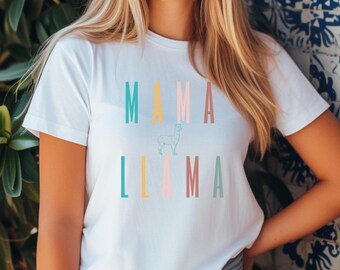 May include: White t-shirt with the text "MAMA LLAMA" in colourful letters. A small outline of a llama is between the words.