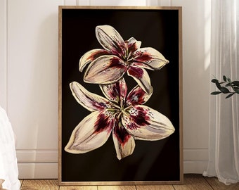 May include: A framed print of two white lilies with burgundy accents on a black background. The lilies are in bloom and have a delicate, feminine feel.
