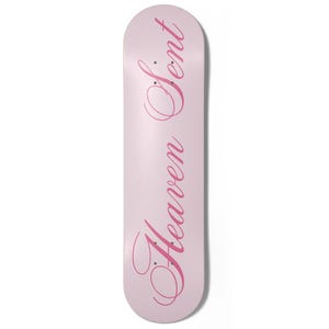 May include: A light pink skateboard with the words "Heaven Sent" in a cursive, dark pink font. The skateboard is a standard size and shape, with a rounded nose and tail.