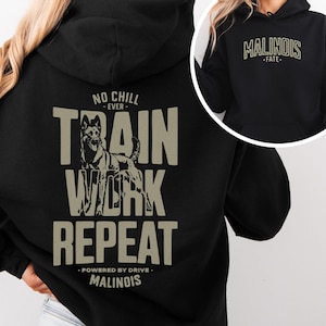 May include: Black hoodie with a tan graphic on the back featuring a Belgian Malinois dog and the words "TRAIN WORK REPEAT". The text "NO CHILL EVER" and "POWERED BY DRIVE" are also included. The front of the hoodie has the word "MALINOIS" in tan.